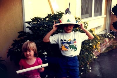 A picture of Ian Byrd in a dinosaur outfit